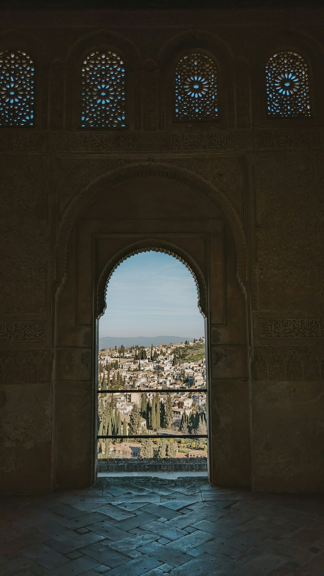 10-Day Travel Route Through Spain: The Essential Itinerary 22 City view framed through an archway in Granada