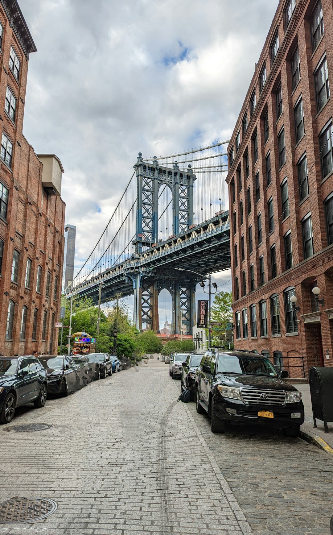 City street with a bridge visible in the background