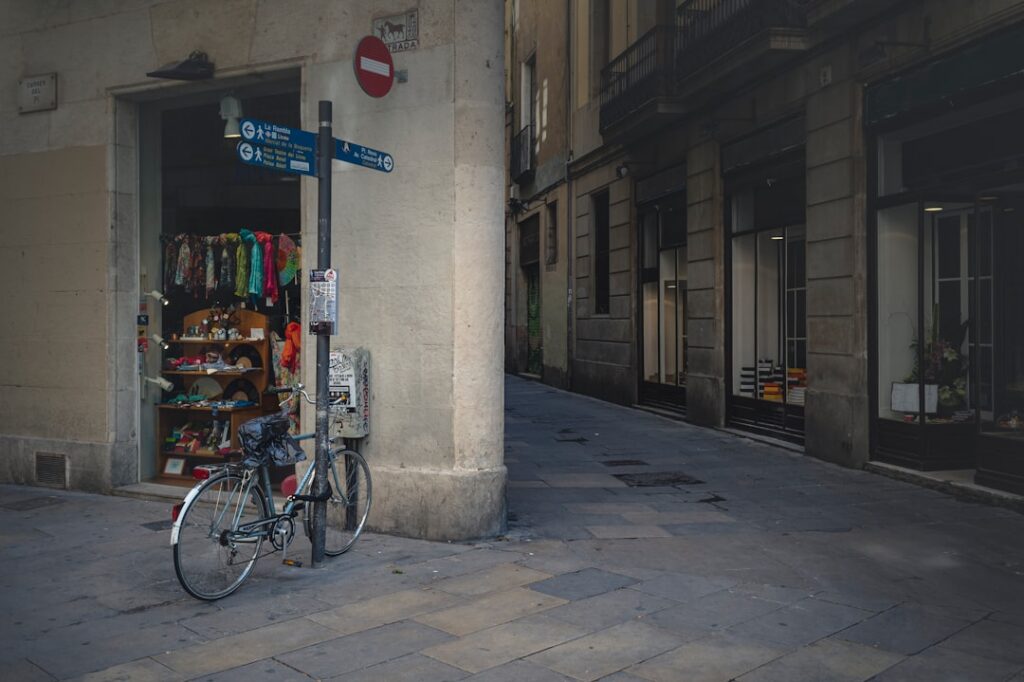 Bicycles parked beside a Barcelona road, a scene for those wondering where to stay barcelona
