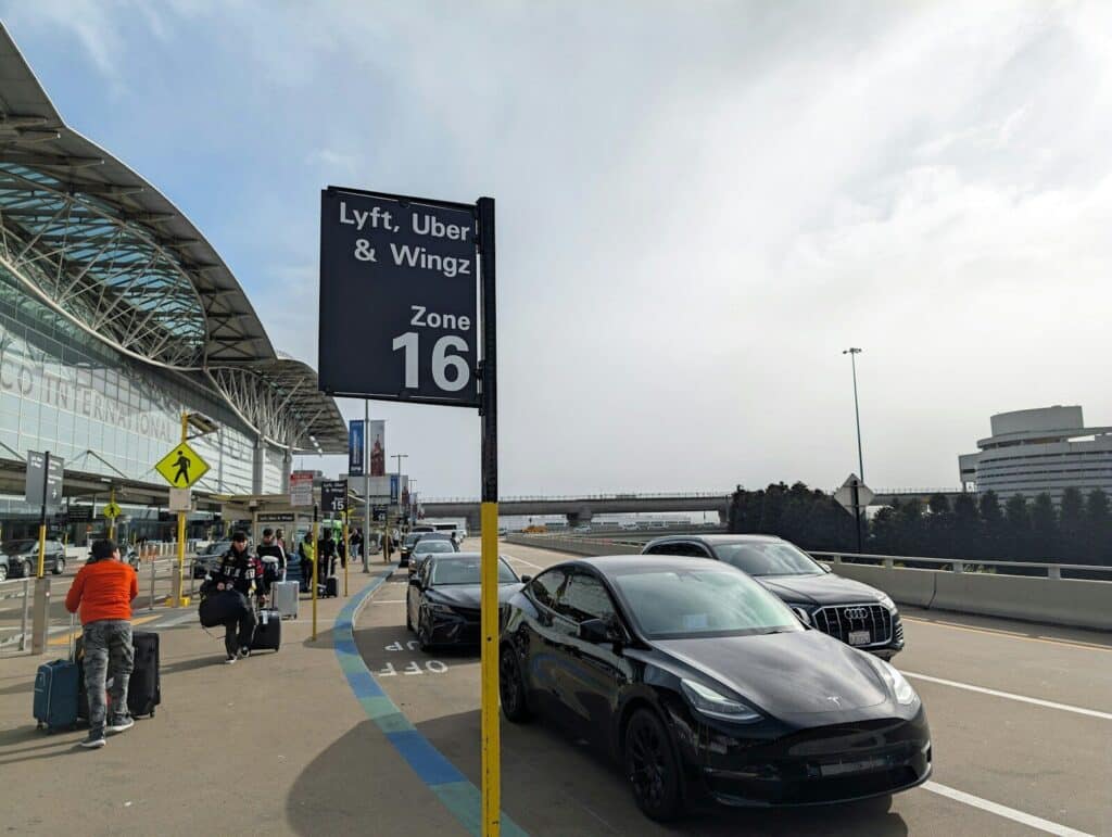 A car parked in front of an airport