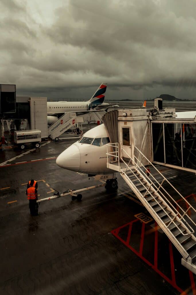 Airplane parked at an airport gate before departure