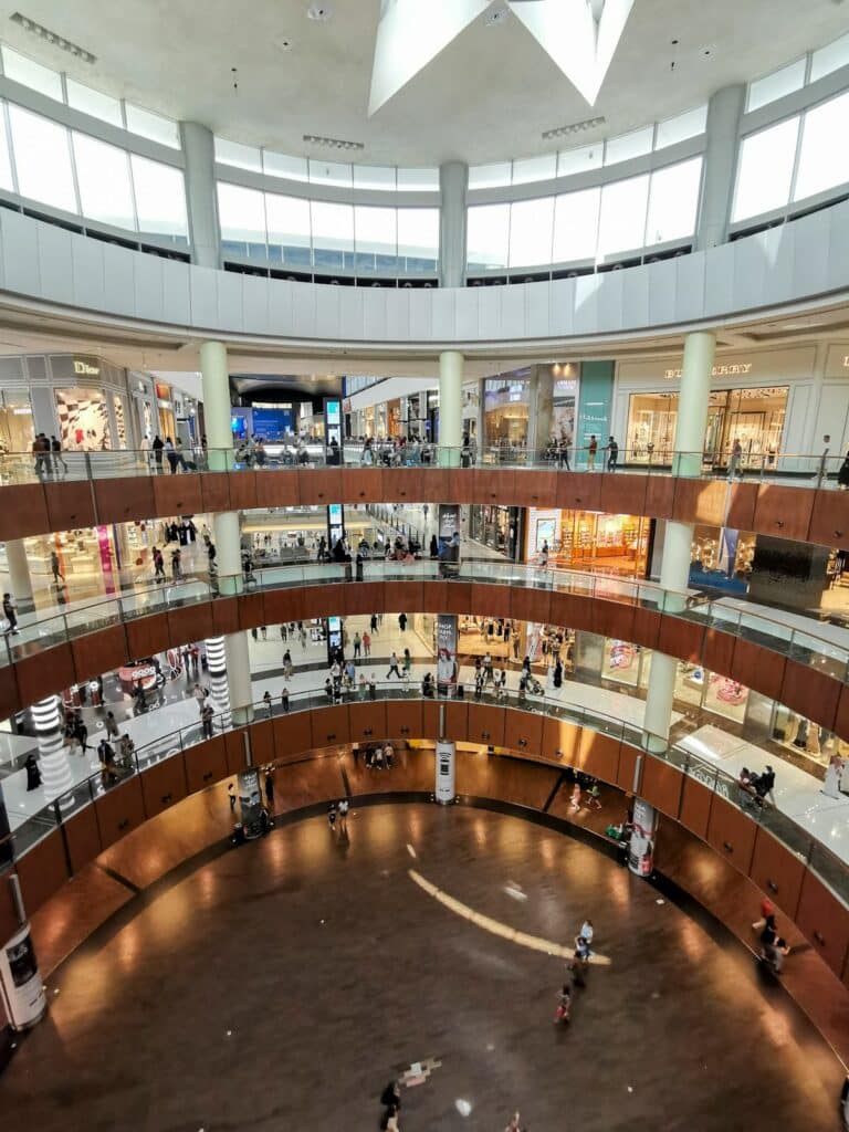 Shoppers walking through an air-conditioned mall in Dubai