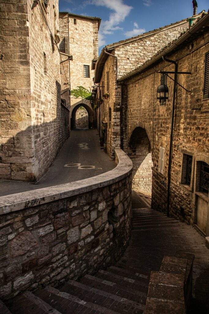 A brick building sits beside the water in the Umbria region