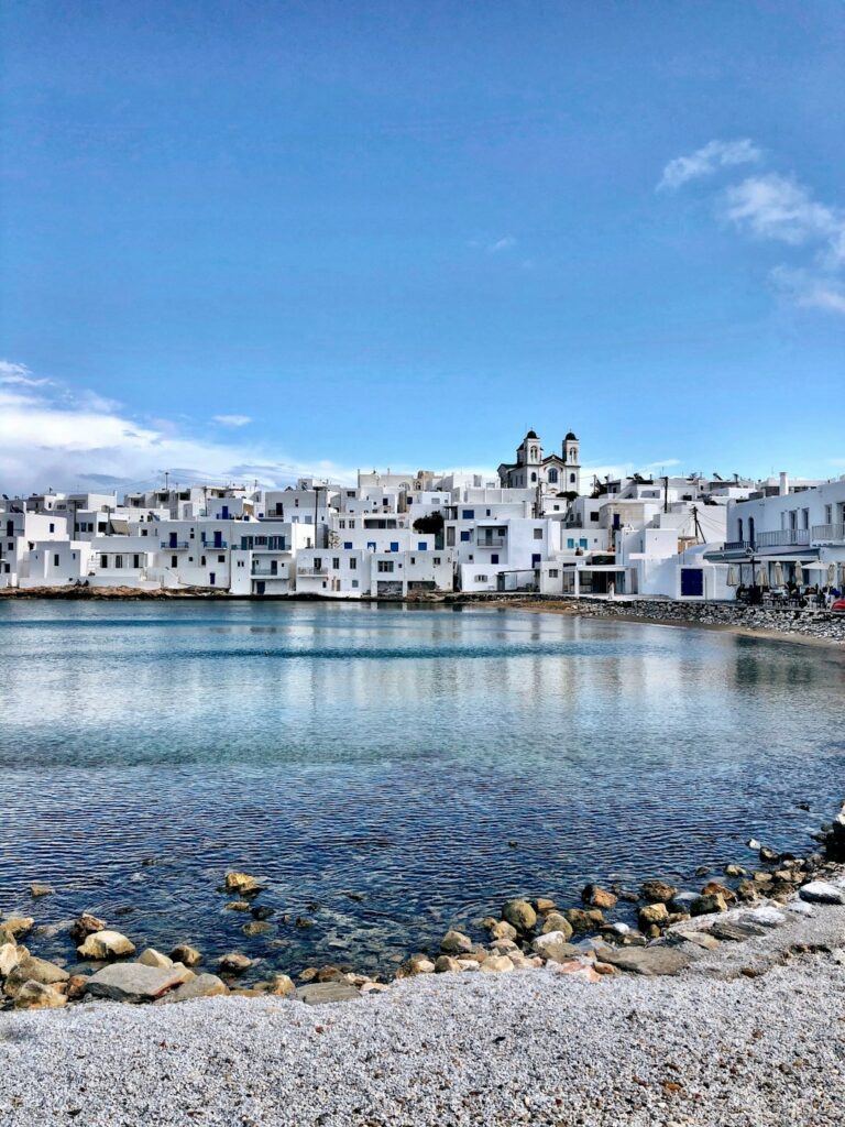 Naousa harbour in Paros with fishing boats lined along the waterfront
