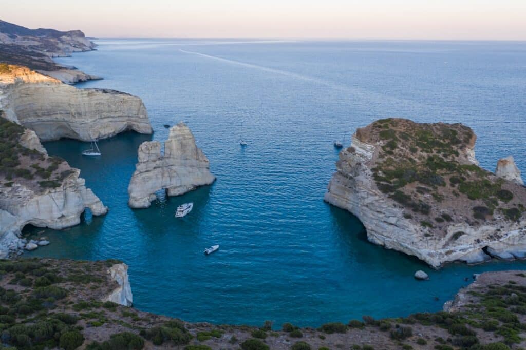 Kleftiko rock formations in Milos rising from clear turquoise water