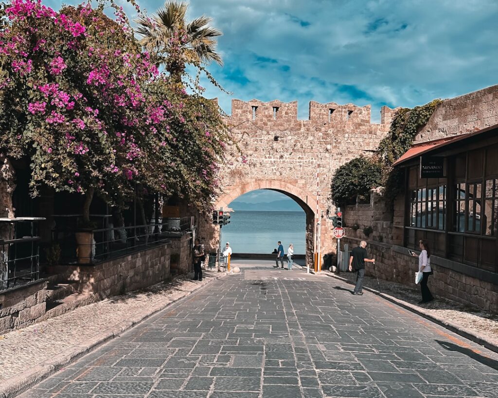 Cobbled street in Rhodes Old Town flanked by traditional stone buildings