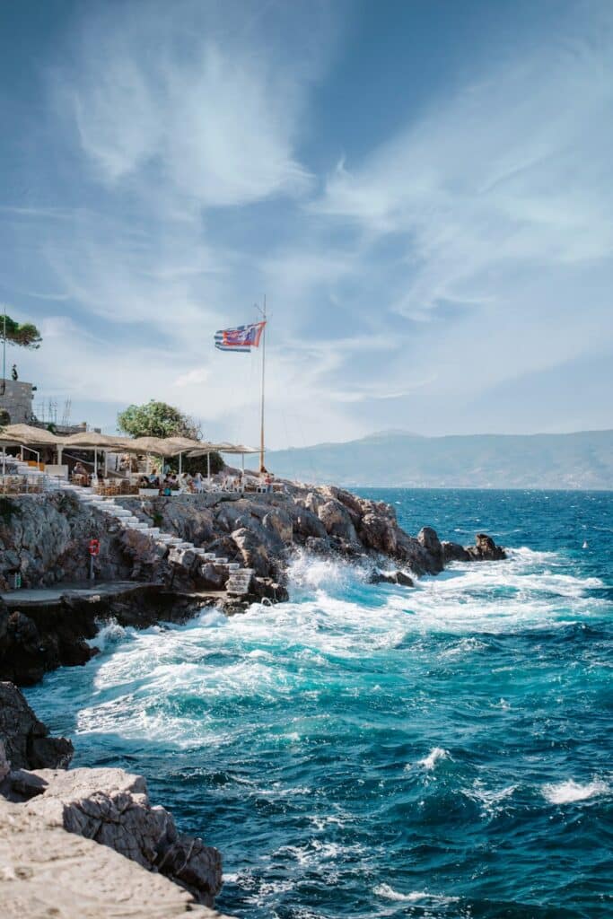 Waterfront scene on Hydra with stone buildings along the harbour