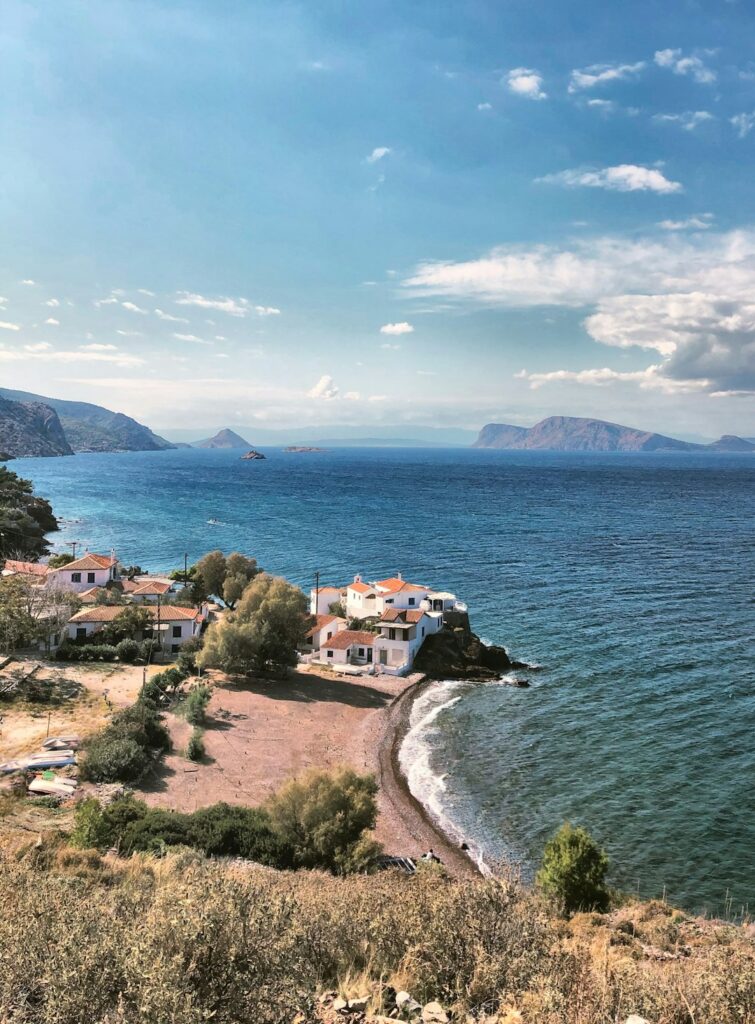Hillside village scene on Hydra with stone houses above the water
