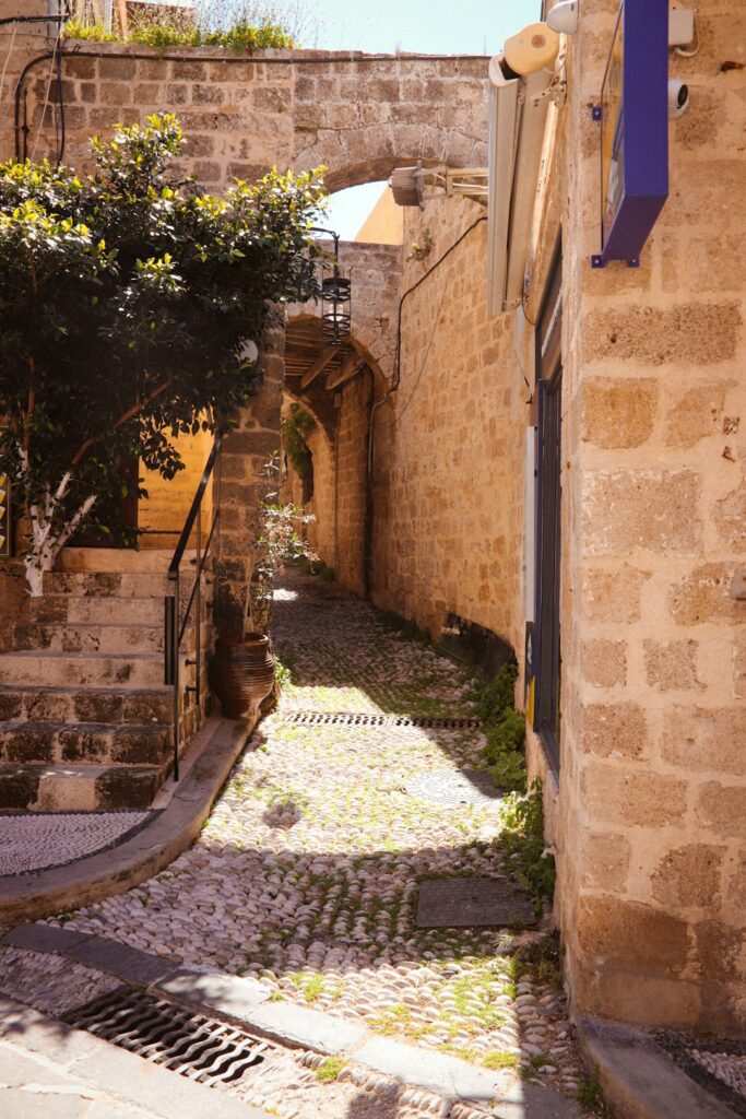 Stone tower and fortified walls of the medieval town of Rhodes