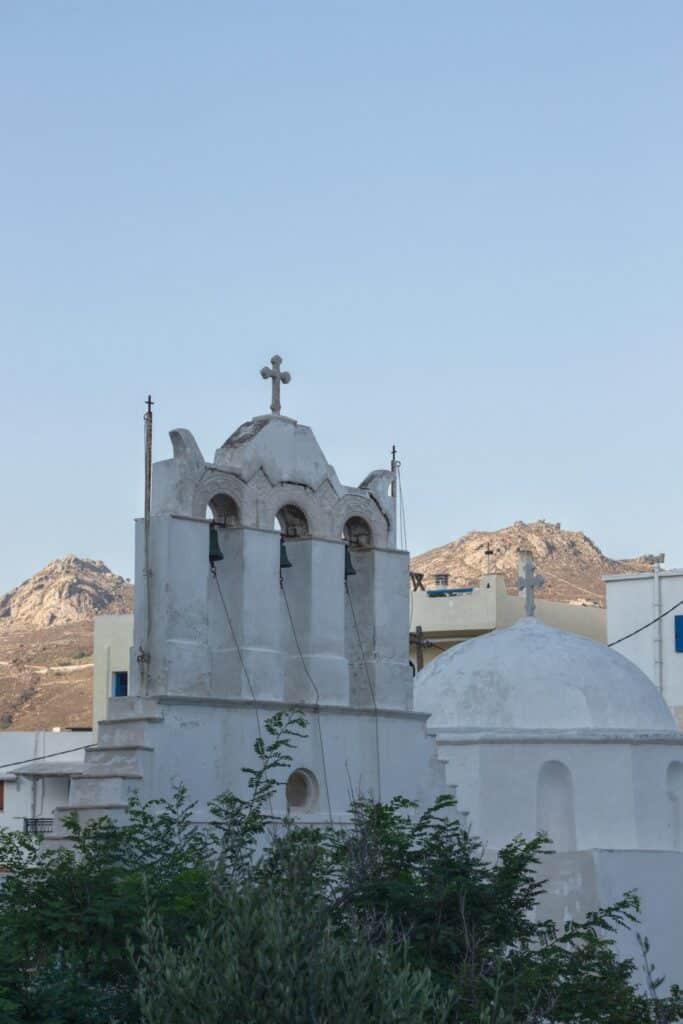 Alternatives to Santorini: Less Crowded Greek Islands Worth Visiting 16 Small white church with a cross overlooking the Cyclades