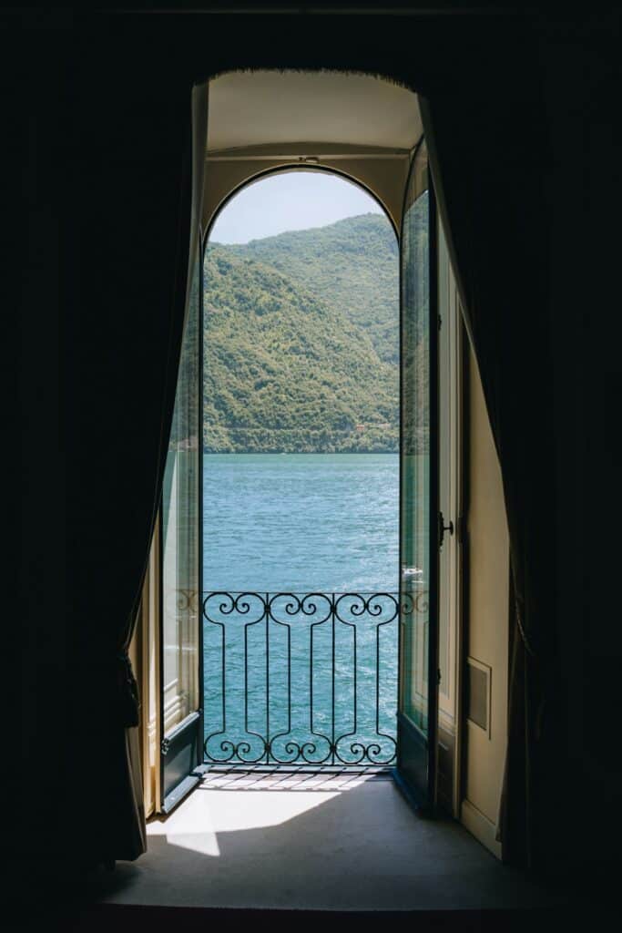 Open doorway framing a view of Lake Como