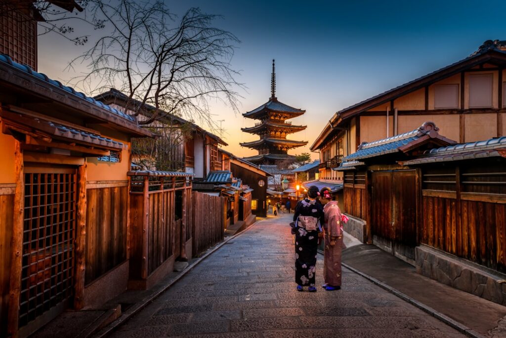 Do You Need a SIM Card in Japan? Your Data Options Explained (2026) 2 two women in traditional kimono standing together on a Japanese street