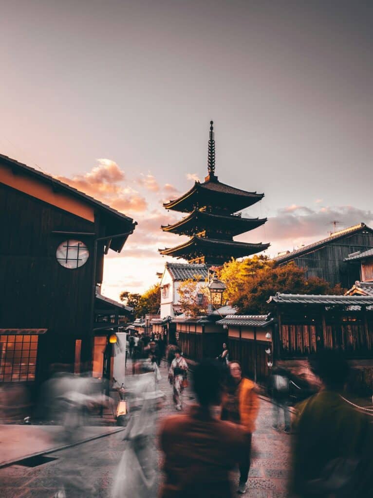 Do You Need a SIM Card in Japan? Your Data Options Explained (2026) 15 pedestrians near a wooden storefront, a common sim card japan purchase point