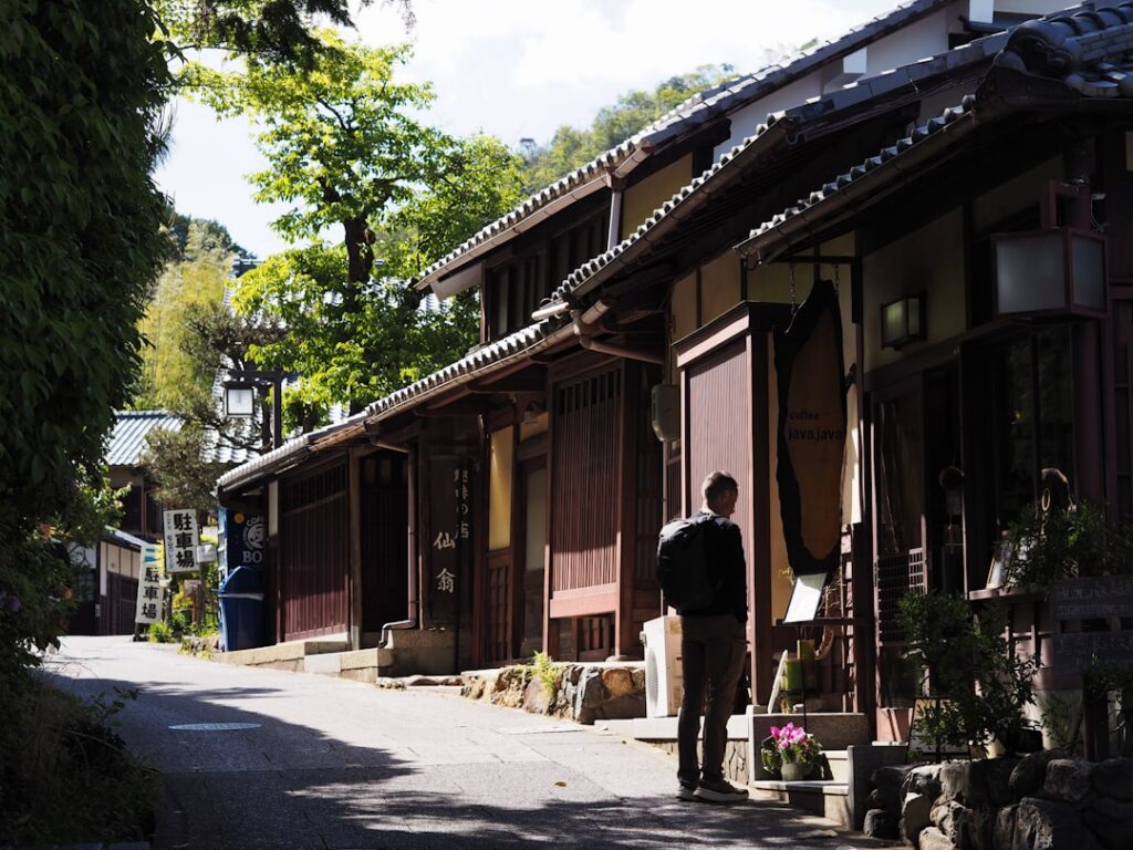 Do You Need a SIM Card in Japan? Your Data Options Explained (2026) 9 traditional Japanese street lined with low wooden buildings