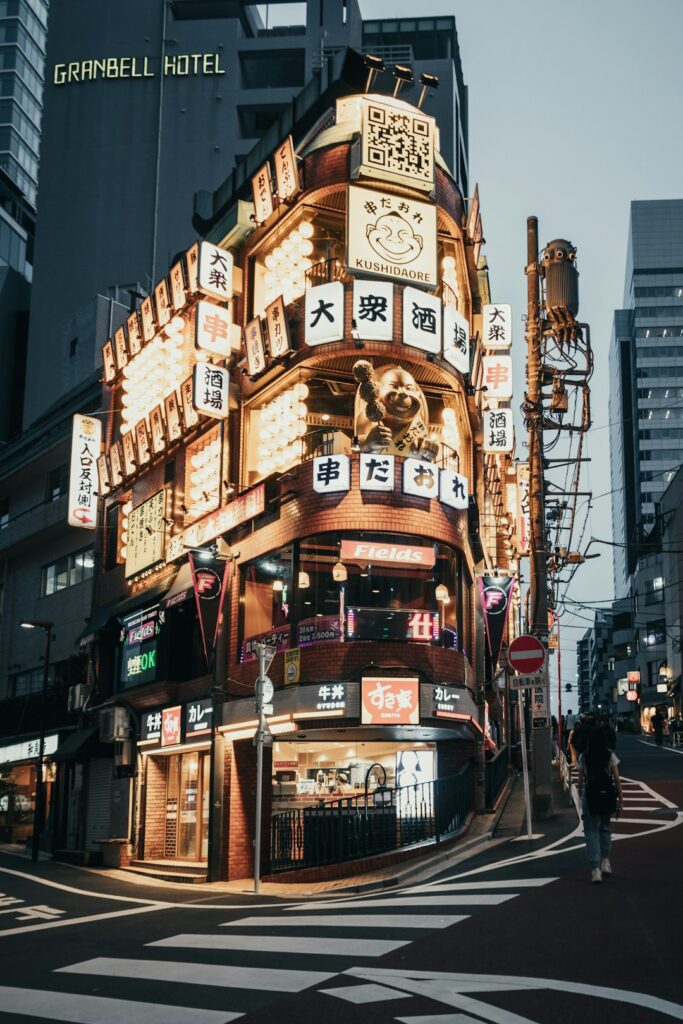 Do You Need a SIM Card in Japan? Your Data Options Explained (2026) 10 building facade covered in signs and advertisements