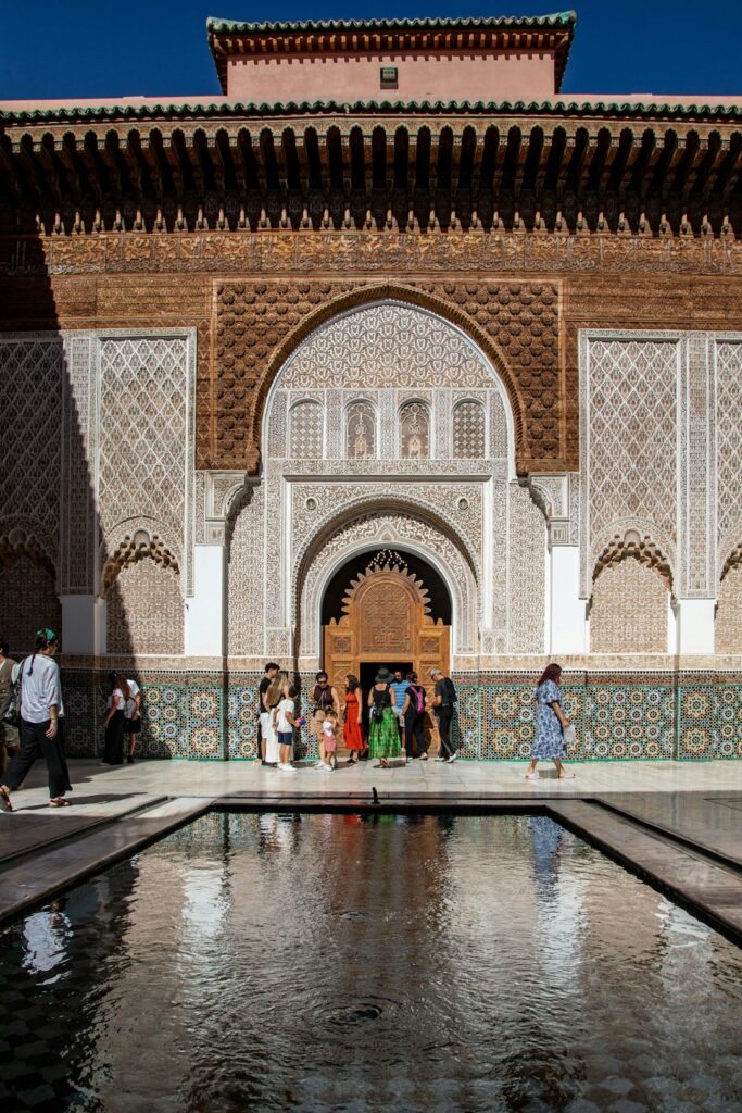 travelers gathered at a historic building entrance in Morocco