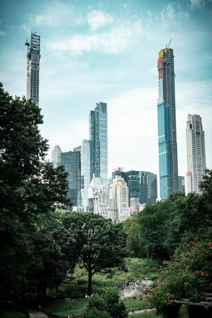 Green trees and quiet greenery tucked between city buildings