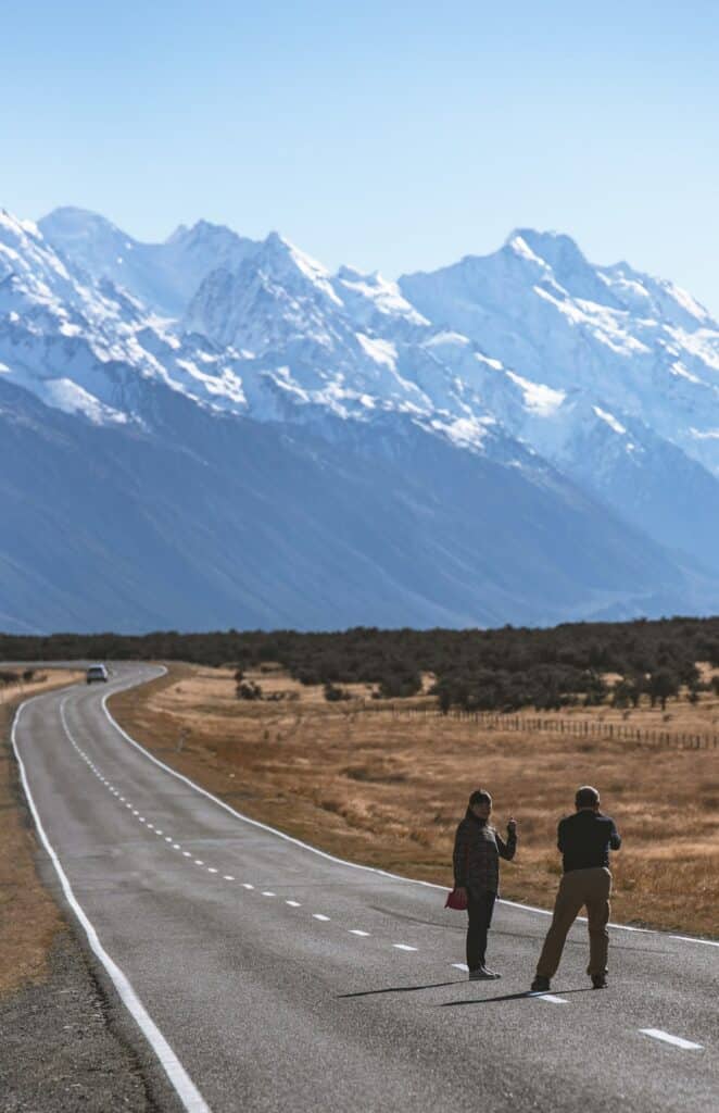 Best Internet Options for Travellers in New Zealand (2026) 3 travelers standing together on a New Zealand city street