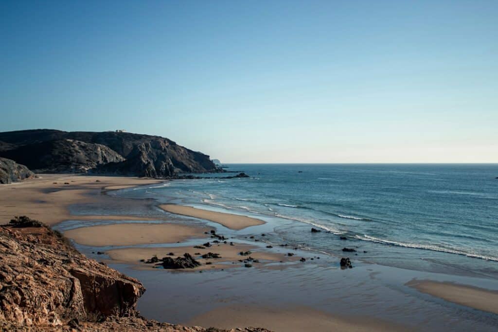 Best Beaches in Portugal: A Guide to the Country's Top Coastal Spots 11 Nazaré beach exposed at low tide along Portugal's central coast