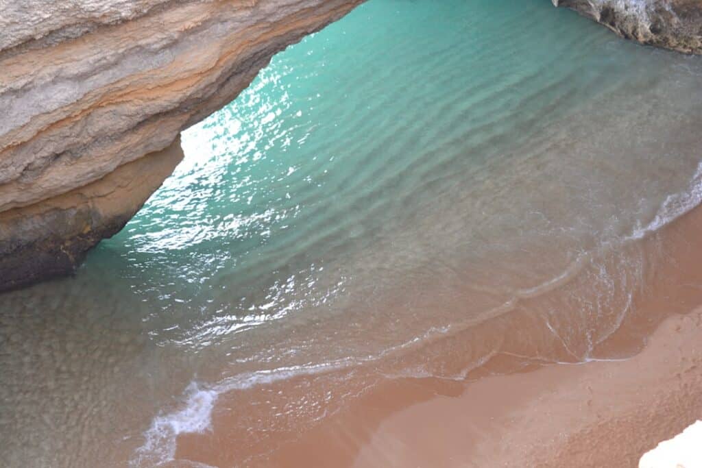 Best Beaches in Portugal: A Guide to the Country's Top Coastal Spots 5 Praia da Marinha with its double sea-arch rock formation and clear water