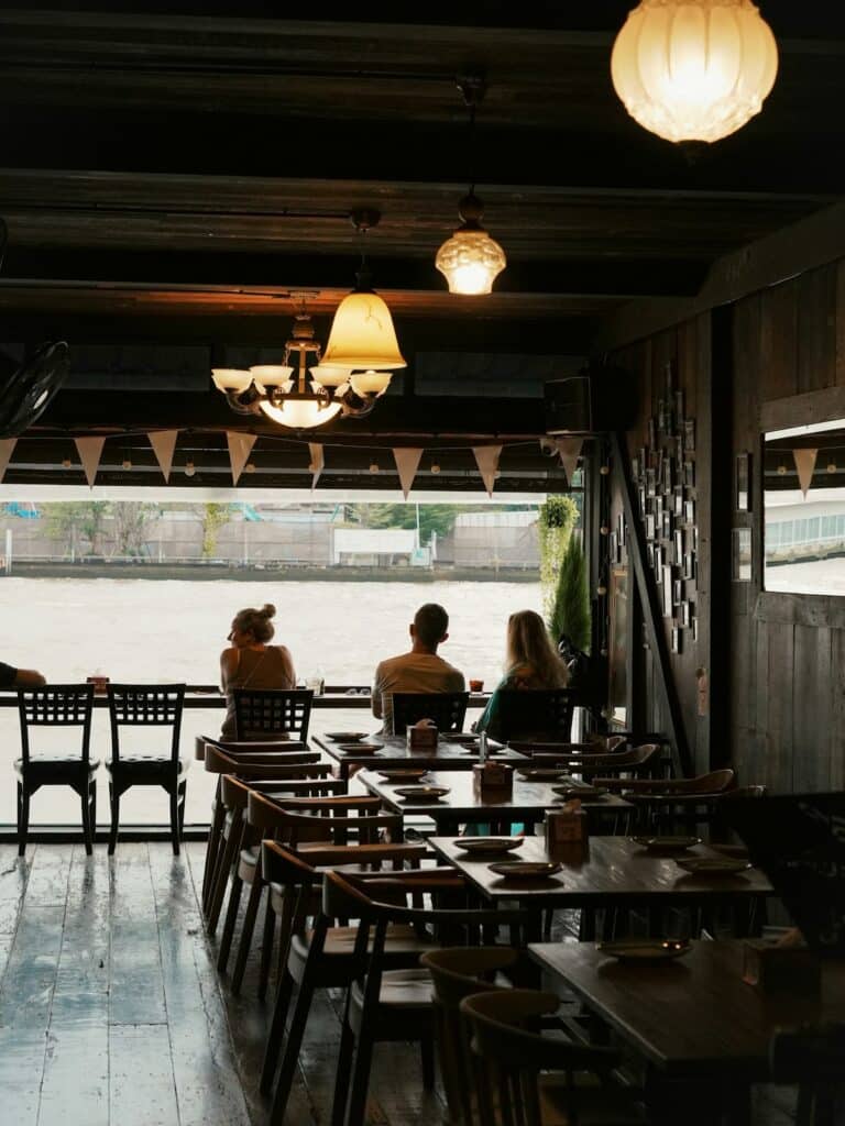 Restaurant seating overlooking the water in Southeast Asia