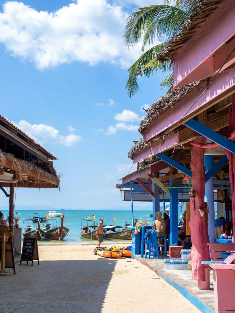 Where to Go in Southeast Asia in Summer: Best Destinations by Month 1 Diners share a beachfront meal during southeast asia summer travel season