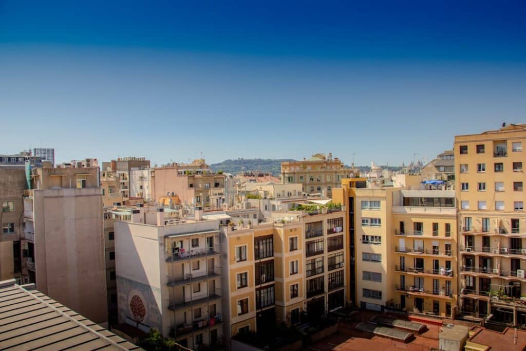 10-Day Travel Route Through Spain: The Essential Itinerary 7 Barcelona's rooftops stretching out under a blue sky