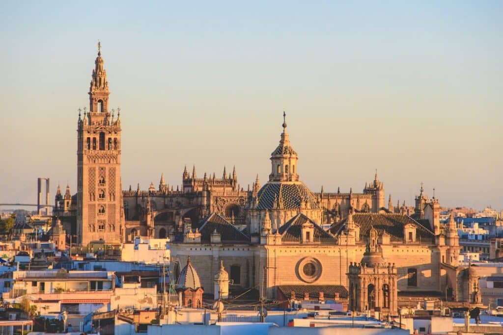 10-Day Travel Route Through Spain: The Essential Itinerary 9 Seville's skyline glowing at sunset