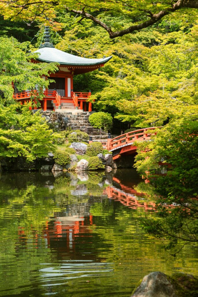 Red temple reflected in the water on a Japan day trip