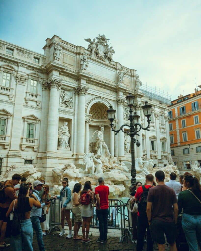 Tourists crowded around Rome's Trevi Fountain in summer
