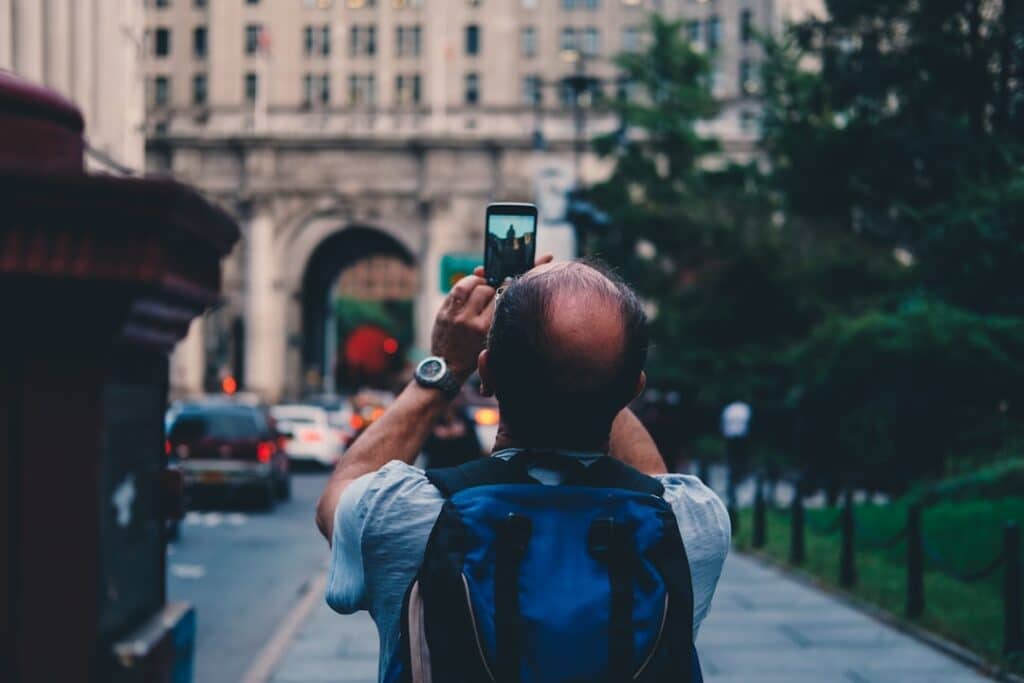 traveler capturing a moment with a smartphone in the UAE