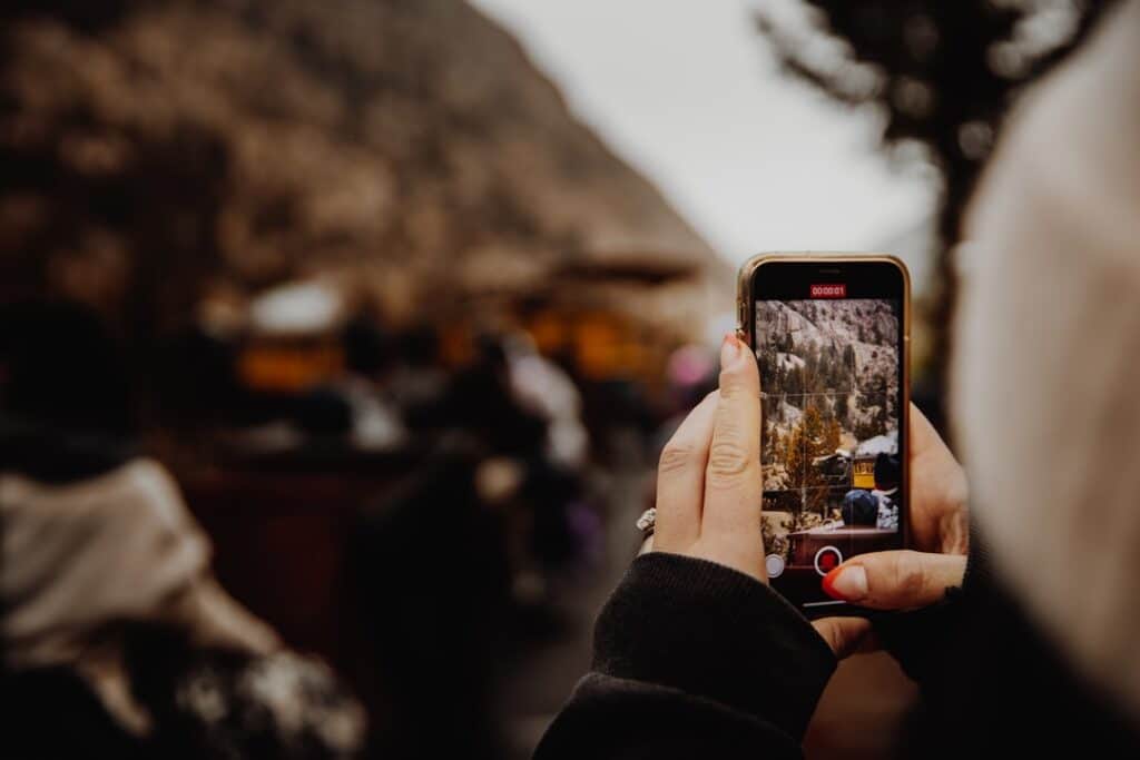 traveler holding a smartphone to check pocket WiFi coverage