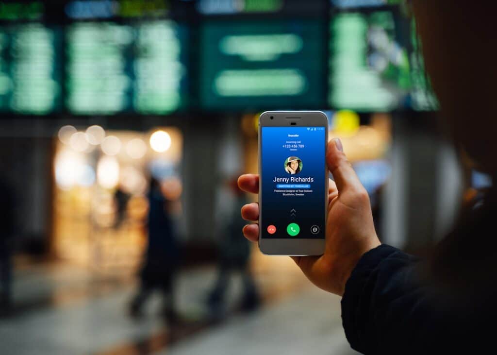 traveler holding a phone to find free WiFi spots in Dubai